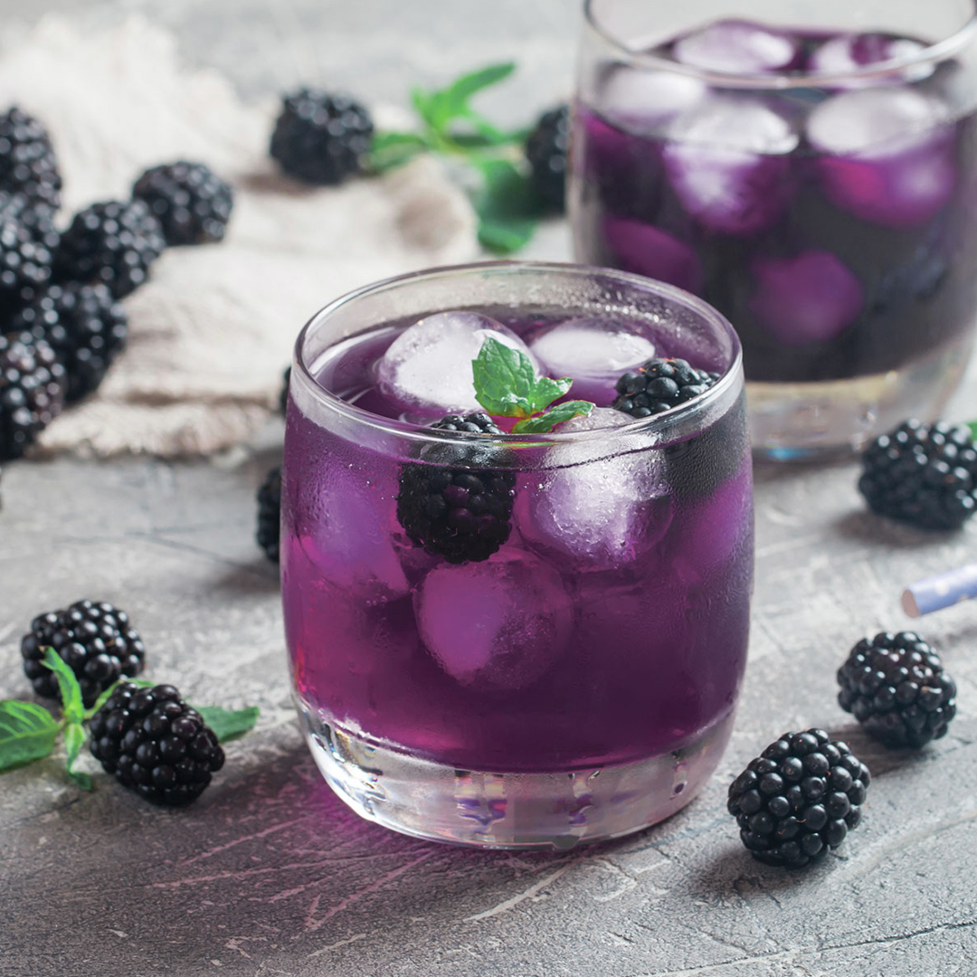 Blue and Purple iced beverage in glass jar