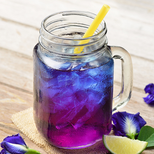 Blue and Purple iced beverage in glass jar